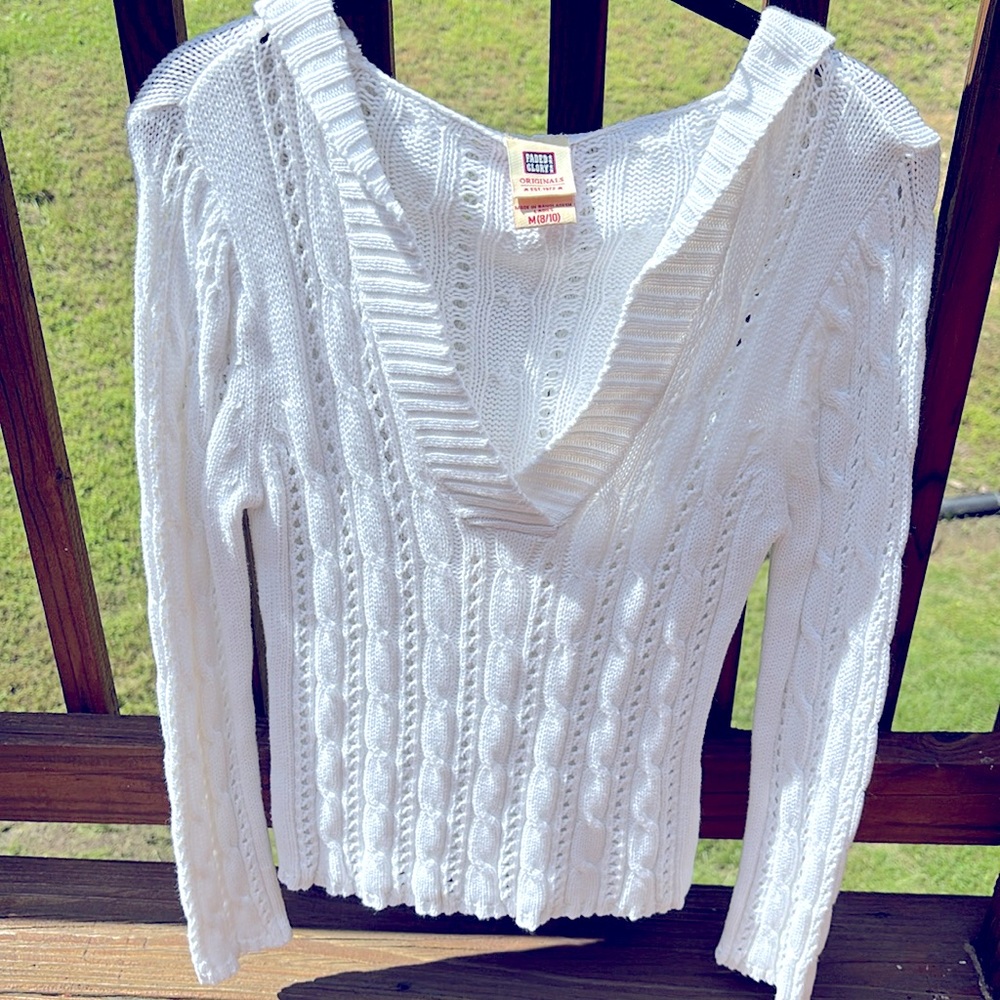 White cable knit sweater with hood.